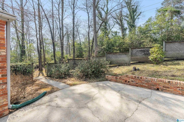 view of patio featuring fence