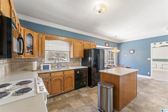 kitchen featuring wallpapered walls, a center island, light countertops, black appliances, and a sink