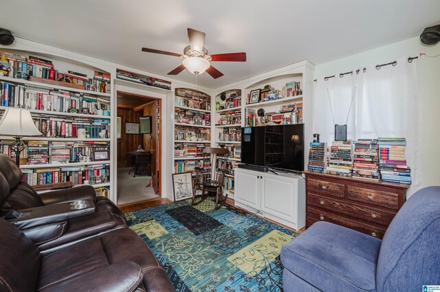 living room featuring a ceiling fan