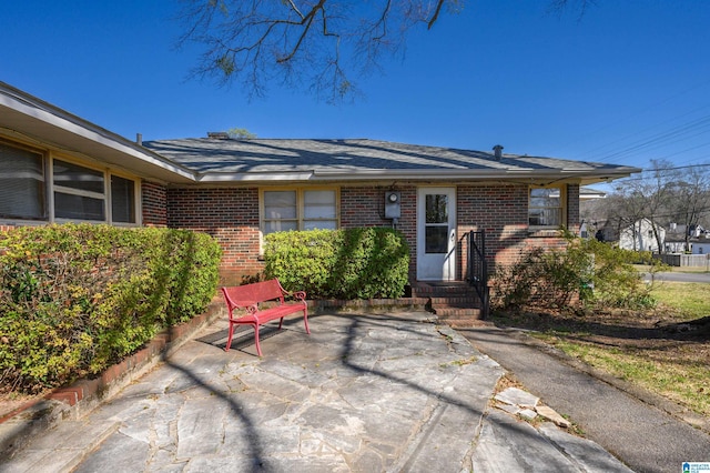 exterior space with brick siding