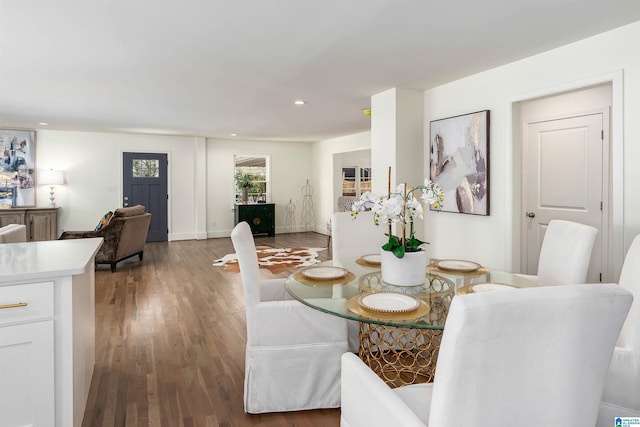 dining area featuring recessed lighting, baseboards, and wood finished floors