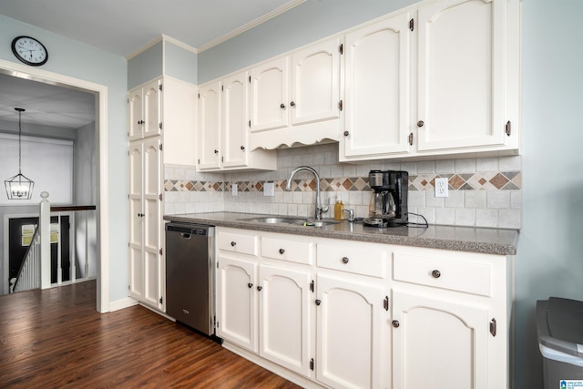 kitchen featuring a sink, dark countertops, decorative backsplash, and stainless steel dishwasher