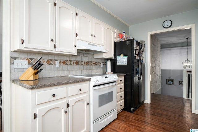 kitchen with electric range, decorative backsplash, white cabinetry, under cabinet range hood, and black fridge