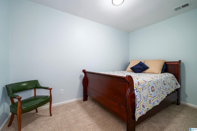 bedroom with baseboards, visible vents, and carpet flooring