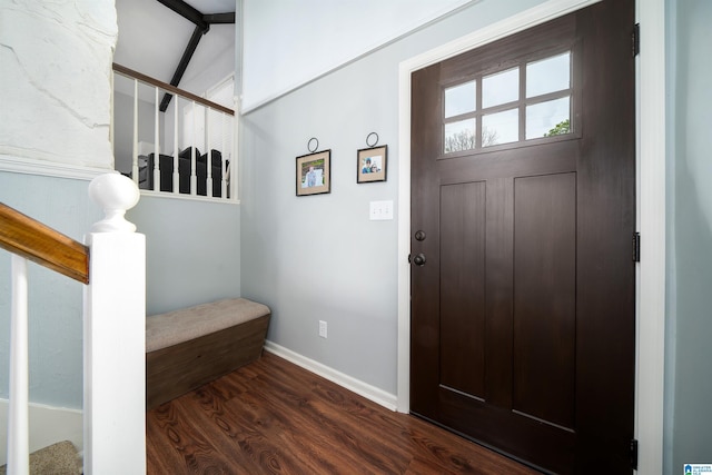 entrance foyer with dark wood finished floors, stairway, and baseboards