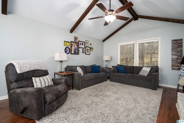 living area featuring vaulted ceiling with beams, baseboards, and wood finished floors