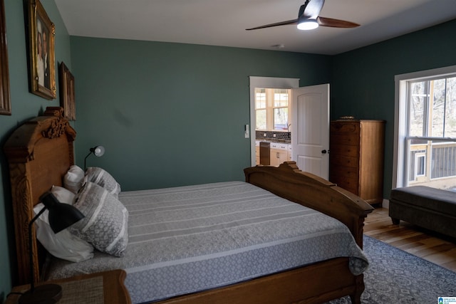 bedroom with a ceiling fan and wood finished floors