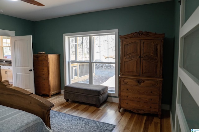 bedroom with a ceiling fan and light wood finished floors