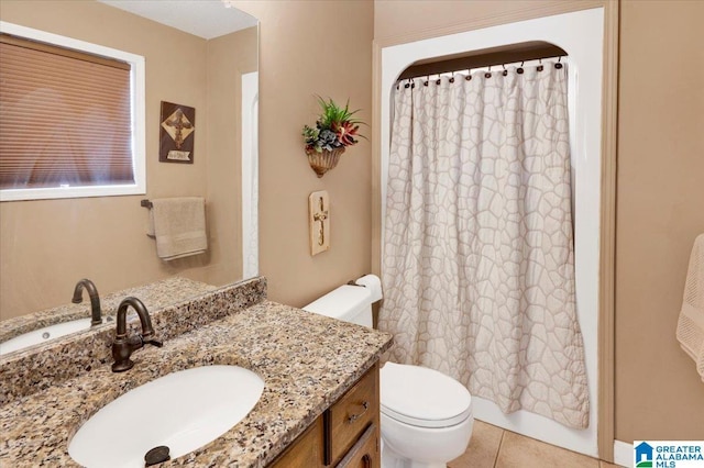 bathroom with shower / bath combination with curtain, vanity, toilet, and tile patterned floors