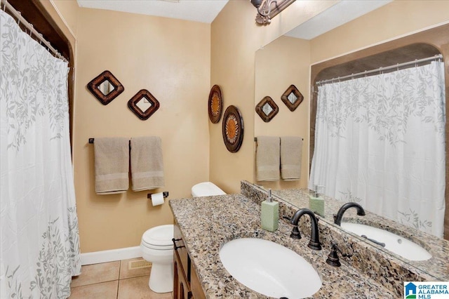 full bathroom with visible vents, baseboards, toilet, tile patterned flooring, and vanity