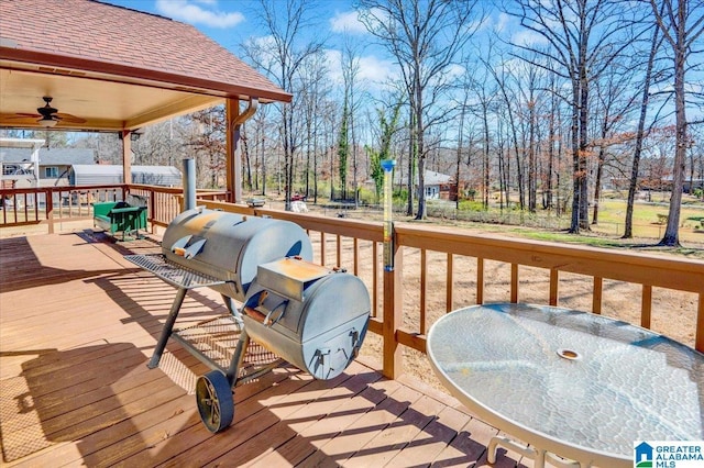 wooden terrace with a ceiling fan