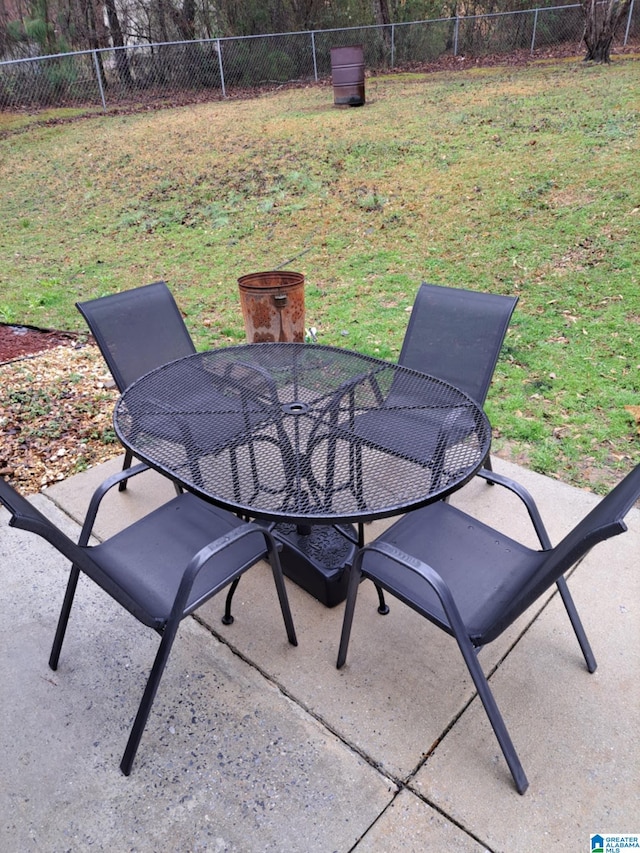 view of patio / terrace featuring fence and outdoor dining area