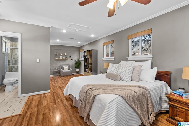 bedroom with recessed lighting, baseboards, light wood-style floors, attic access, and crown molding