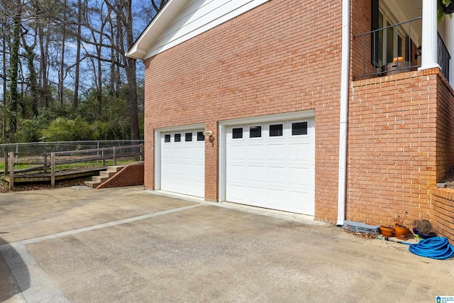 garage featuring driveway