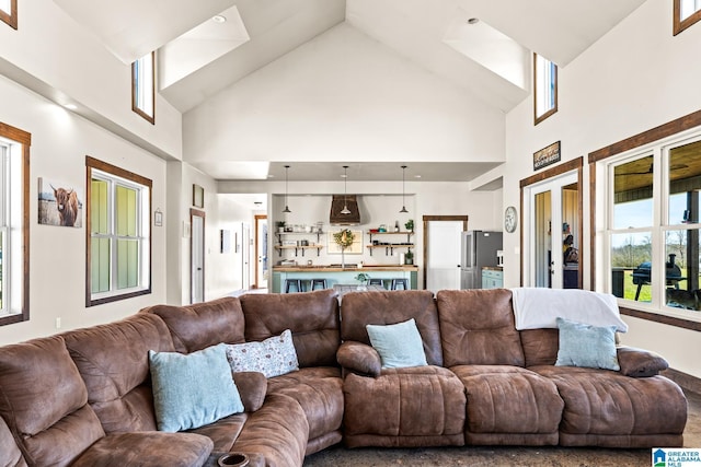 living area featuring a towering ceiling