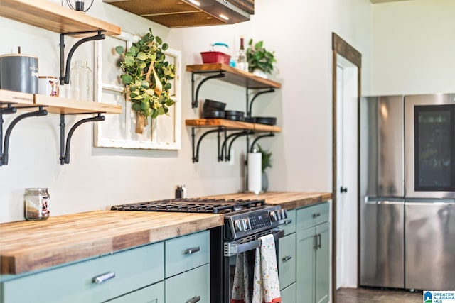 kitchen with gas stove, wooden counters, open shelves, smart refrigerator, and blue cabinets