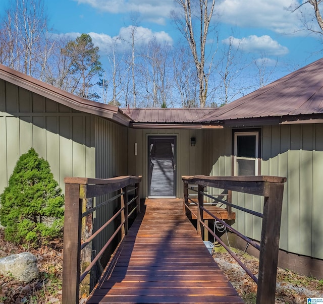 doorway to property with metal roof and board and batten siding