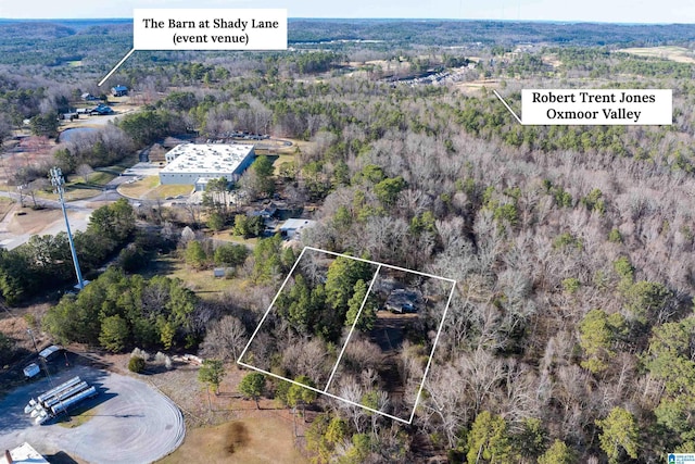 aerial view featuring a view of trees