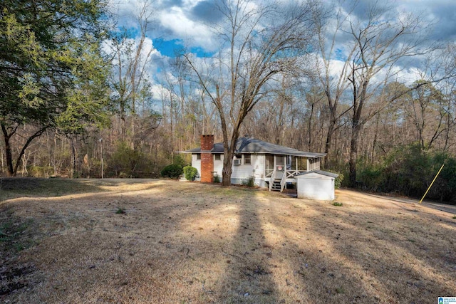 ranch-style house featuring a chimney