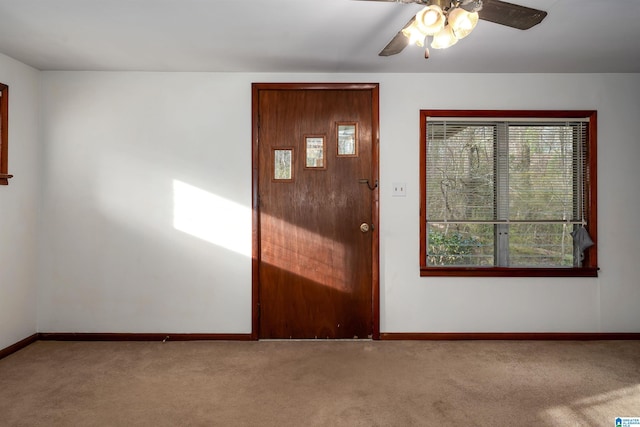 interior space featuring a ceiling fan and baseboards