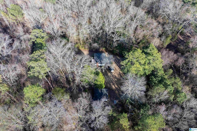 drone / aerial view featuring a forest view