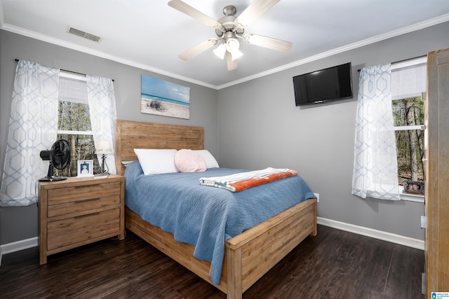 bedroom with ornamental molding, wood finished floors, and visible vents