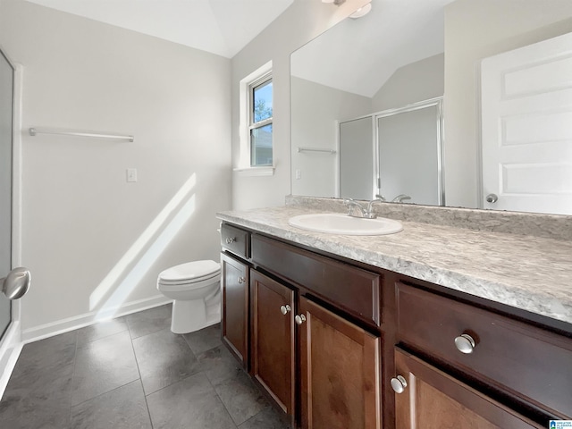 full bathroom with vaulted ceiling, a stall shower, and vanity