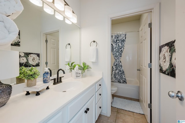 bathroom with tile patterned floors, shower / tub combo, toilet, and vanity