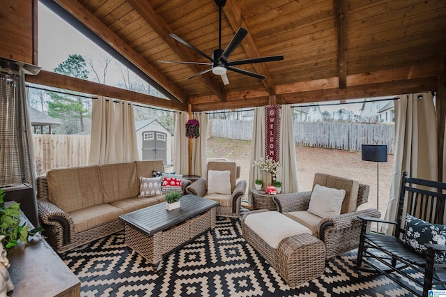 sunroom / solarium featuring wooden ceiling, vaulted ceiling with beams, and a ceiling fan