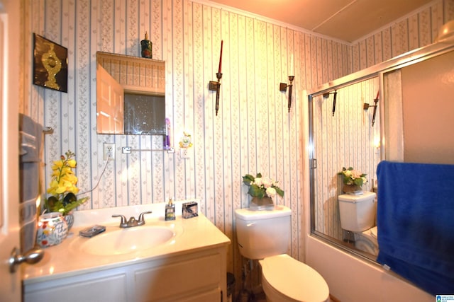 full bathroom featuring vanity, toilet, and wallpapered walls