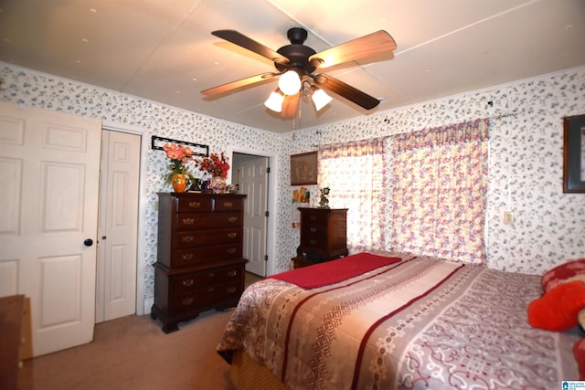 bedroom with ceiling fan, carpet floors, and wallpapered walls