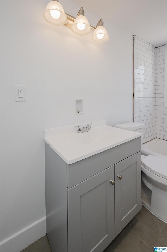 full bath featuring a bathtub, a shower, toilet, vanity, and tile patterned flooring