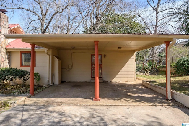 view of vehicle parking with a carport and concrete driveway