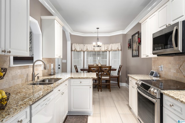 kitchen with stainless steel appliances, white cabinetry, and a sink