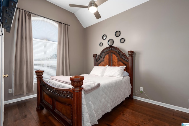 bedroom featuring lofted ceiling, ceiling fan, baseboards, and wood finished floors