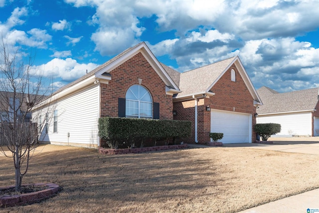 view of front facade featuring brick siding, a shingled roof, concrete driveway, a front yard, and a garage