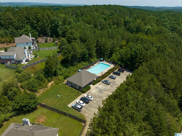 birds eye view of property with a wooded view