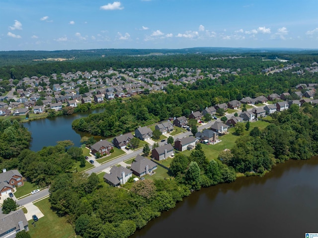 drone / aerial view with a water view and a residential view