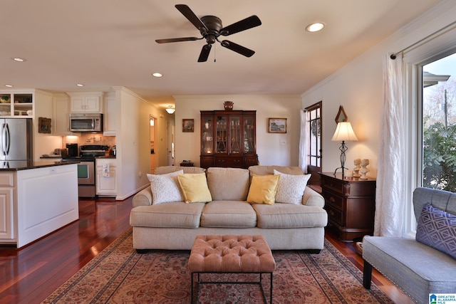 living room with dark wood-style floors, ceiling fan, recessed lighting, and crown molding