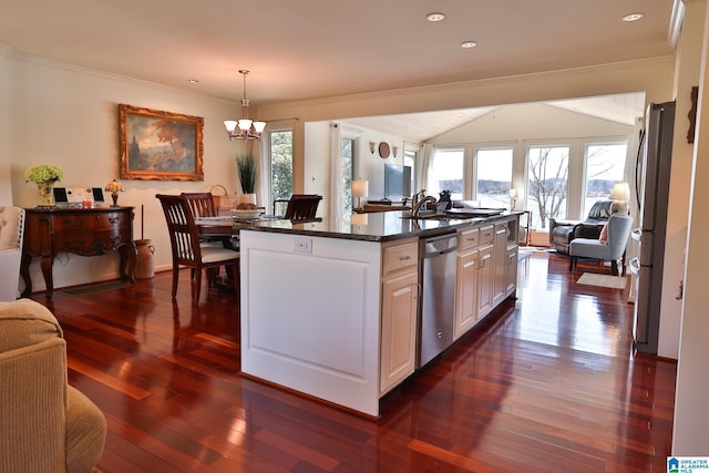 kitchen with open floor plan, stainless steel appliances, dark wood-style flooring, and crown molding