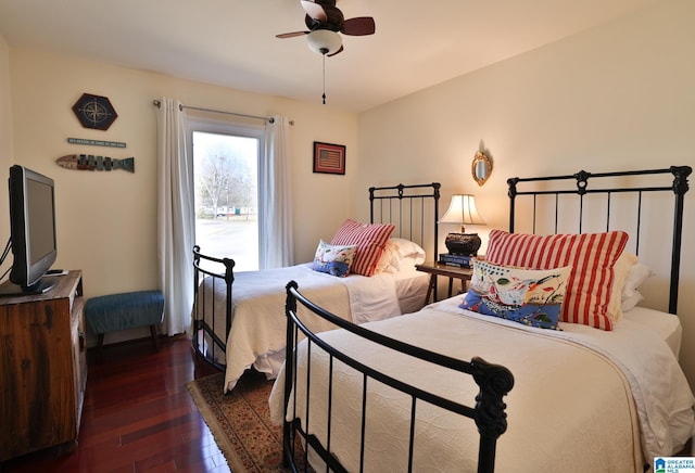 bedroom featuring ceiling fan and dark wood-type flooring