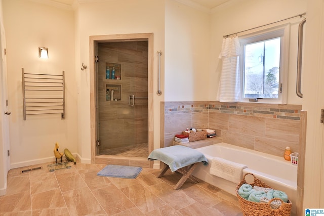 full bathroom with a garden tub, crown molding, radiator, visible vents, and a stall shower