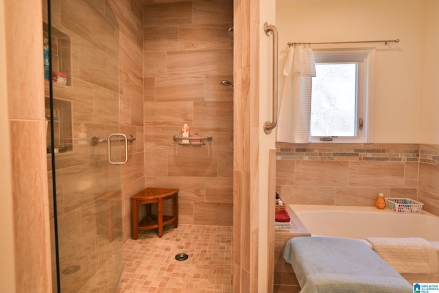 full bath featuring a stall shower and a bath