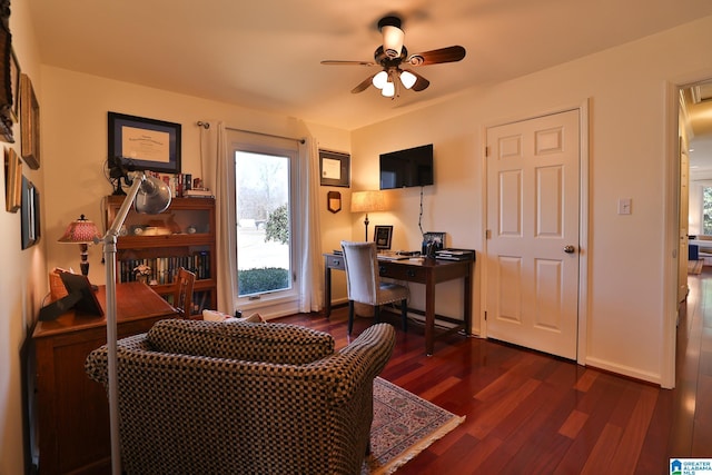 office space featuring ceiling fan, dark wood-type flooring, and baseboards