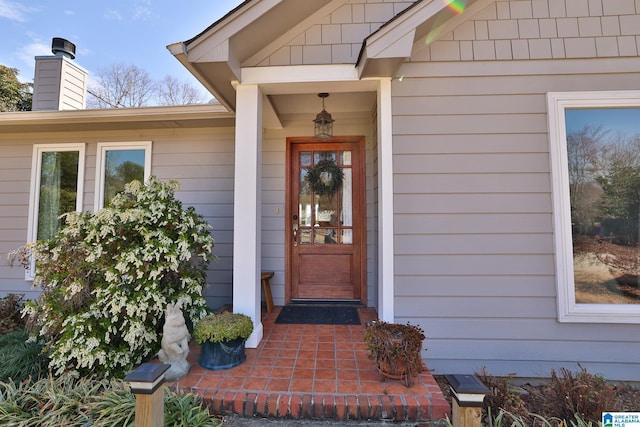 entrance to property with a chimney