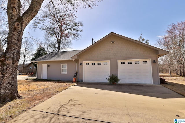 ranch-style house with driveway and a garage