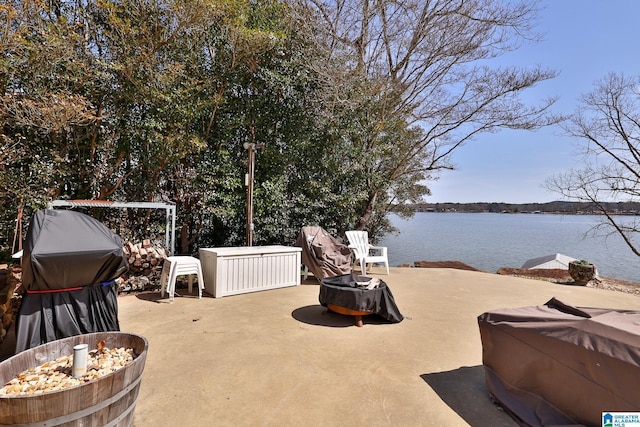 view of patio with a water view