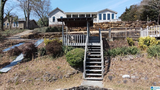 exterior space with stairway and a wooden deck