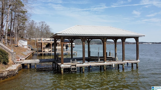 dock area featuring a water view and boat lift