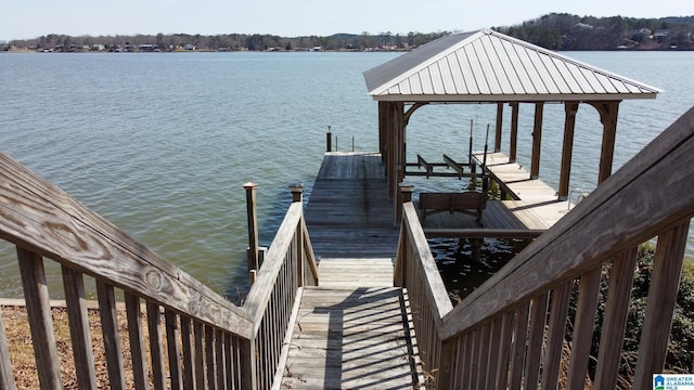 view of dock featuring a water view and boat lift